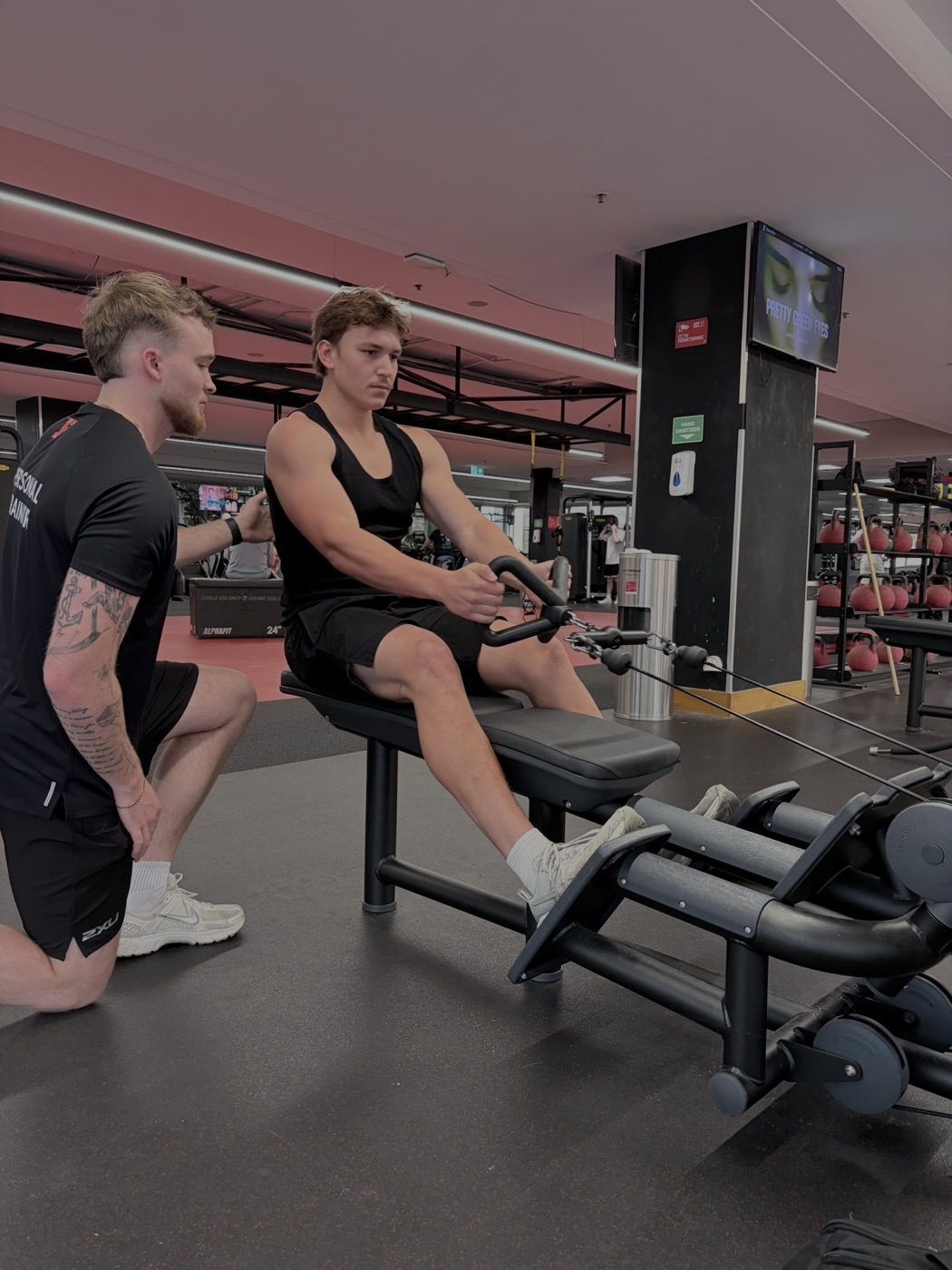 Austin Lynch coaching a client at Fitness First Willoughby